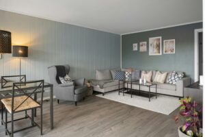 Sleek gray living room with modern furniture and stylish decor elements.